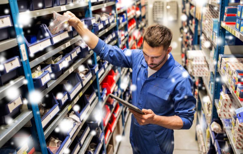 Worker stocking items in a warehouse