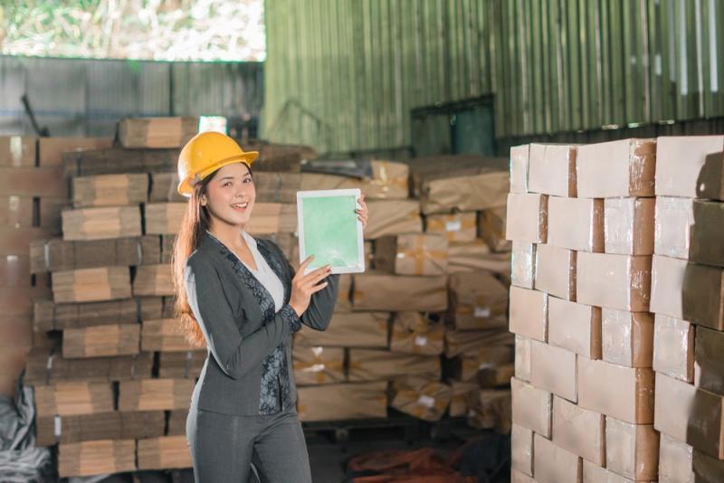Plastic organizing box in a warehouse setting