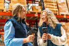 Two workers talking in a warehouse